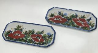 A pair of three Highland Stoneware platters of octagonal form, decorated with poppies and thistles