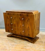 A modern figured walnut veneered chest in the Art Deco taste, fitted three drawers on shaped
