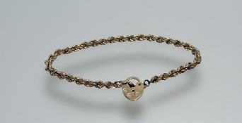 A 9ct gold rope pattern bracelet with 9ct gold padlock: d. x 7.5cm 2.5g