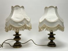 A pair of cast brass table lamps with scalloped shaped stems, together with a pair of Victorian-