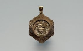 A 9ct gold St Christopher pendant: h. x 4cm l. x 2.5cm 7.19g