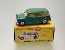 A Dinky Toys No 197 Morris Mini-Traveller in a green body, lemon interior, silver trim and spun