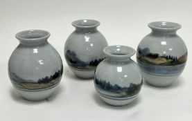 A collection of four Highland Stoneware bud vases, each of squat form with hand-painted Scottish