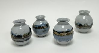 A collection of four Highland Stoneware bud vases, each of squat form with hand-painted Scottish