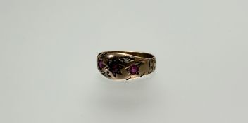 A late 19thc early 20thc yellow metal ring pink stone graduated star set ring largest stone