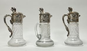 A set of three Portuguese silver palated mounted hob nail and slice cut wine decanters with