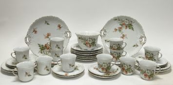 A 20th Century hand-painted tea service decorated with foliate motifs with gilt edges comprising a