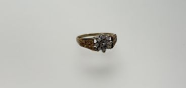 A 9ct gold diamond cluster ring set nine diamond points R 2.22g