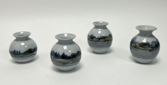 A collection of four Highland Stoneware bud vases, each of squat form hand-painted with Scottish
