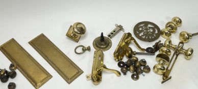 A collection of mixed Victorian and later brass door furniture suitable for restoration/cabinet