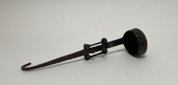 A 20th Century ladel in the Tibetan style, with brass studs to handle (l. 32cm)