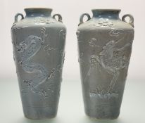 A pair of Korean celadon-glazed stoneware vases, probably early 20th century, twin-handled, each