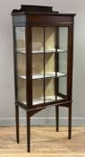 An Edwardian mahogany display cabinet, ledge back over astragal glazed door, enclosing three lined