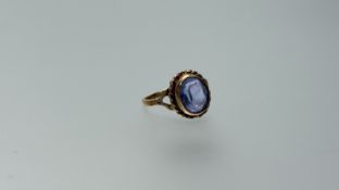 A 9ct gold ring set oval facet cut aquamarine approximately 1.5ct within a rope border M 3.11g