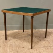 A vintage Vono foldaway card table, square green baize top raised on hinged supports: H. 68cm L.