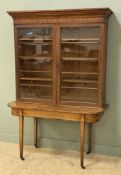 A 19th century mahogany bookcase, moulded top over twin glazed panel doors enclosing three shelves