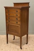 An Edwardian inlaid mahogany sheet-music cabinet, ledge back over four fall-front drawers and a
