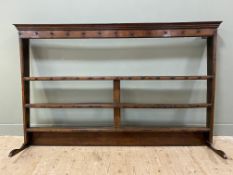 An 18th century oak dresser top/ plate rack, with moulded cornice over three shelves, each with