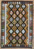 A hand-knotted Chobi kilim rug, central panel with repeating geometric motifs, sand ground: L. 191cm