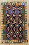 A hand-knotted Maimana kilim rug, central panel with three rows of repeating geometric motifs,