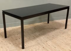 A modern hardwood dining table by RV Astley, rectangular top in black gloss finish, raised on four
