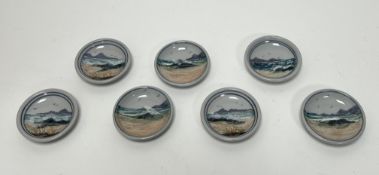 A collection of seven Highland Stoneware small trinket dishes, each decorated with Scottish seascape