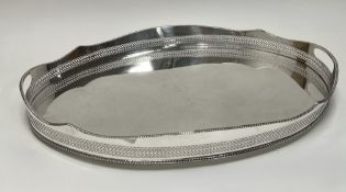 A epns oval gallery drinks tray with rope pattern border with pierced handles to side on bun