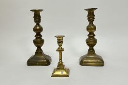A small brass candle stick with beaded edge decoration (h-15.5cm), together with a pair of brass