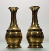 A pair of Arts and Crafts by Daalderop (Holland), brass baluster vases, with a band of moutled motif