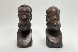 A pair of 20th Century African hand carved wooden busts (h. 20cm) (2)