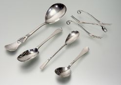 A set of four Danish Georg Jensen silver fruit forks with scrolling berry and leaf handles stamped