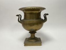 A 20thC brass twin handled planter raised on a square plinth, with rope moulded handles and top (