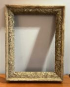 A gilt wood frame with moulded foliate decoration to inner border (interior measurements 44.5cm x