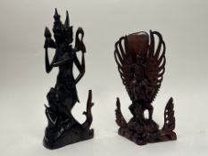 A Balinese wooden carved figure group of deity Vishnu riding his mount Garuda (h. 33cm), together