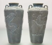 A pair of Korean celadon-glazed stoneware vases, probably early 20th century, twin-handled, each