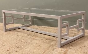 A modern bespoke coffee table, with inset glass panel top over decorative sides, on square