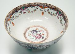 A 18thc Chinese Export ware porcelain familie rose punch bowl with chrysanthemums and floral