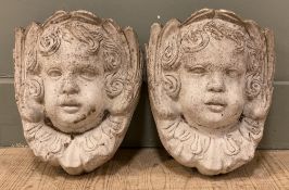 A pair of modern wall-mounted garden pocket planters, of cherub form with curled hair and ruff