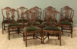 A set of eleven reproduction mahogany dining chairs, shield-shaped backs with pierced splat and dark
