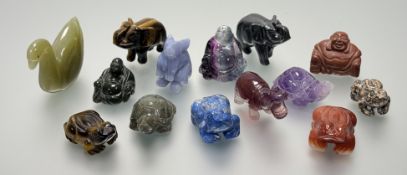 A collection of various miniature carved stone figures comprising, a green stone carved swan, two