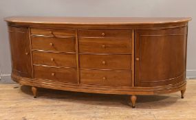 A substantial modern sideboard by Willis & Gambier, bow front with eight graduated drawers to