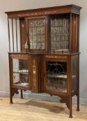 An Edwardian Art Nouveau display cabinet, inlaid mahogany cornice over leaded glass doors and sides,