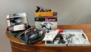 A collection of power tools consisting of a Performance 1100W circular saw, Power Devil Jigsaw,