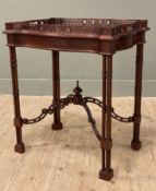 A reproduction Chippendale-style silver table, serpentine-shaped pierced ledge to tray top, raised