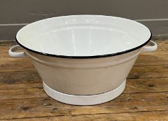 A white and black enamel metal wash basin with twin handles (h. 22cm x w. 56cm)