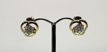 A pair of modern 9ct gold open work stud cluster earrings set seven circualr diamonds