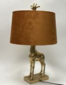 Glenmorangie: A decorative table lamp in the form of a giraffe, the resin body with a gilt finish,