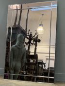 A Modern frameless rectangular hall mirror, with cut edge border. (106x74cm)