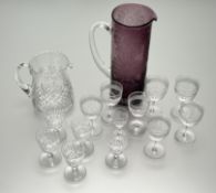 A collection of glassware comprising, eight various sized wine glasses all with same cut band
