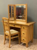 A modern oak dressing table, with three-panel folding mirror to top, fitted with one central